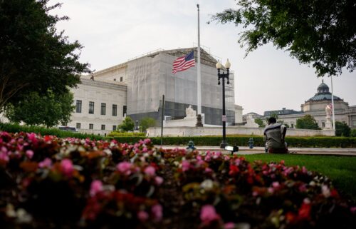 A person rests in front of the U.S. Supreme Court on June 5