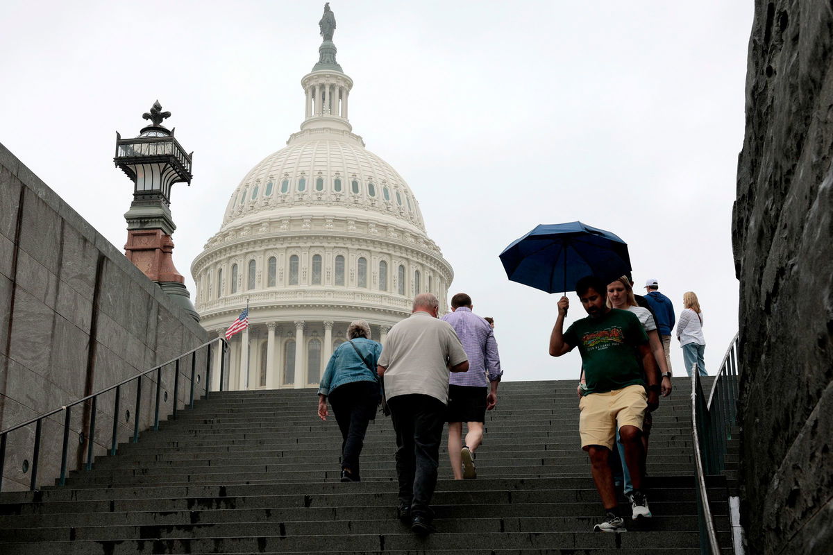 <i>Anna Moneymaker/Getty Images via CNN Newsource</i><br/>Tourists walk near the US Capitol visitor center on June 16 in Washington