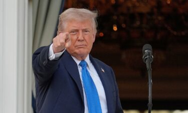 President Donald Trump gestures after speaking during a summer soiree on the South Lawn of the White House on June 4.  Trump signed a proclamation Wednesday evening to ban travel from several countries to the US