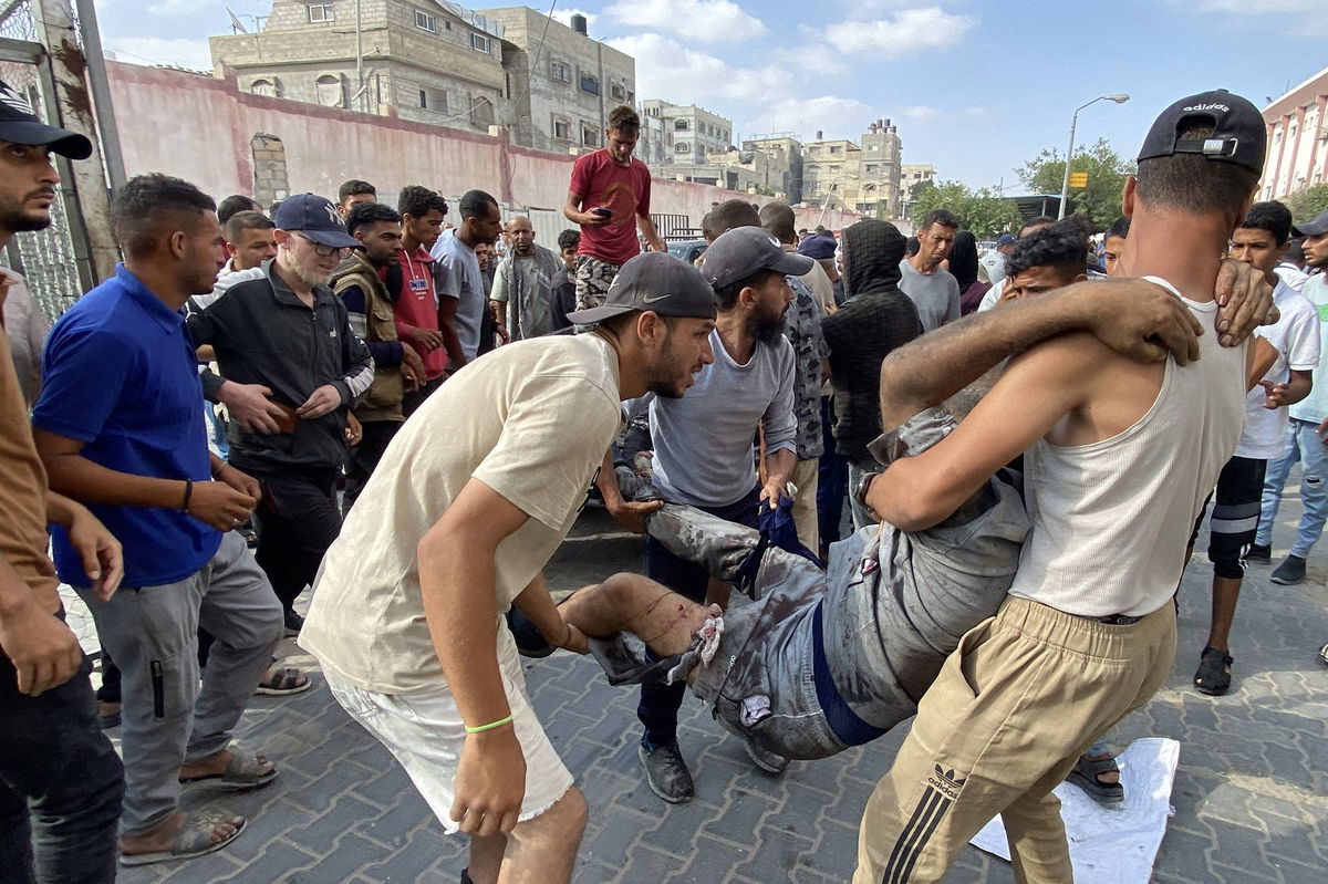 <i>AFP/Getty Images via CNN Newsource</i><br/>Palestinians transport an injured man to Nasser Medical Complex in southern Gaza after the Palestinian Ministry of Health said that over 50 people had been killed while seeking aid in Khan Younis on Tuesday.