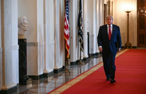 US President Donald Trump arrives to sign the GENIUS Act at the White House in Washington
