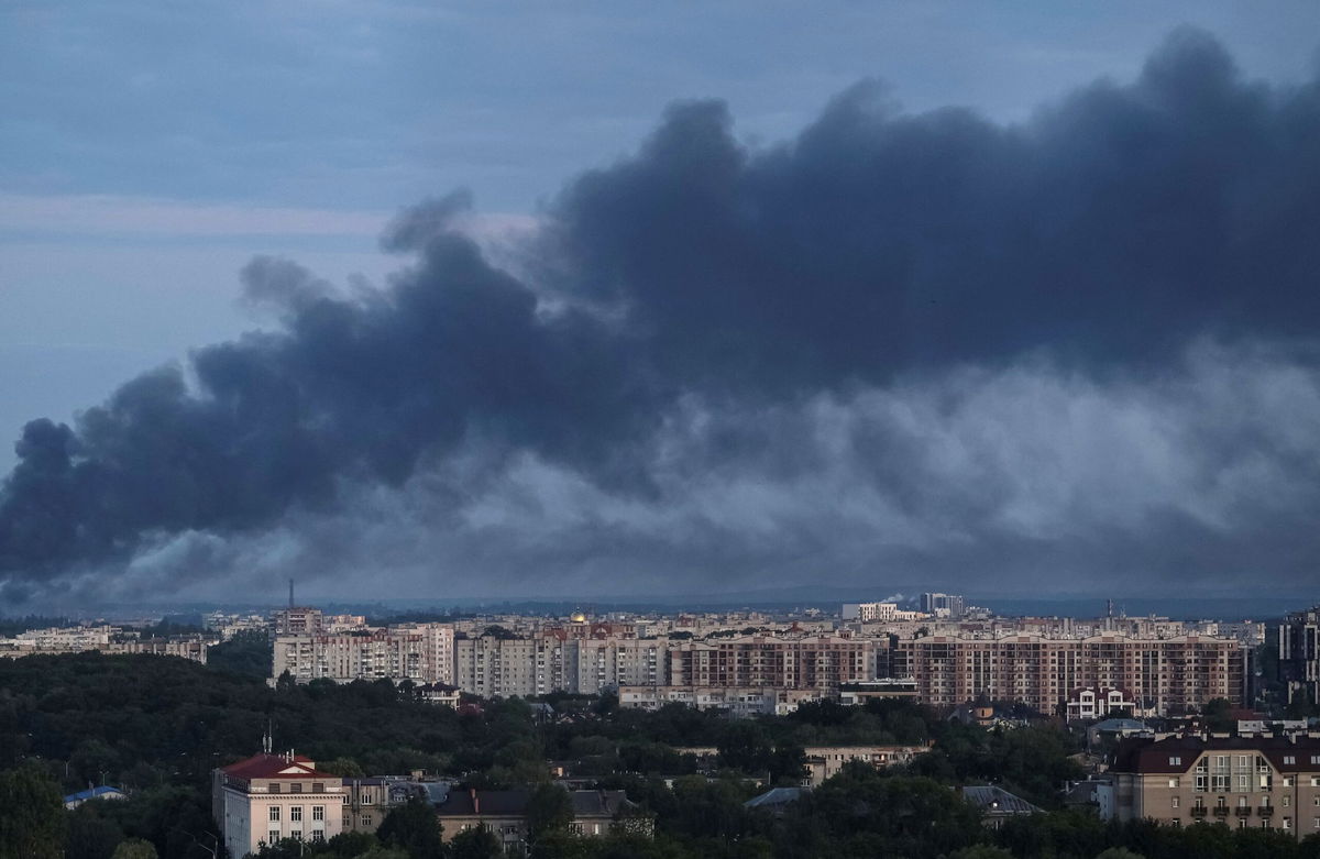 <i>Roman Baluk/Reuters via CNN Newsource</i><br/>Smoke is seen in the city after a Russian drone and missile strike